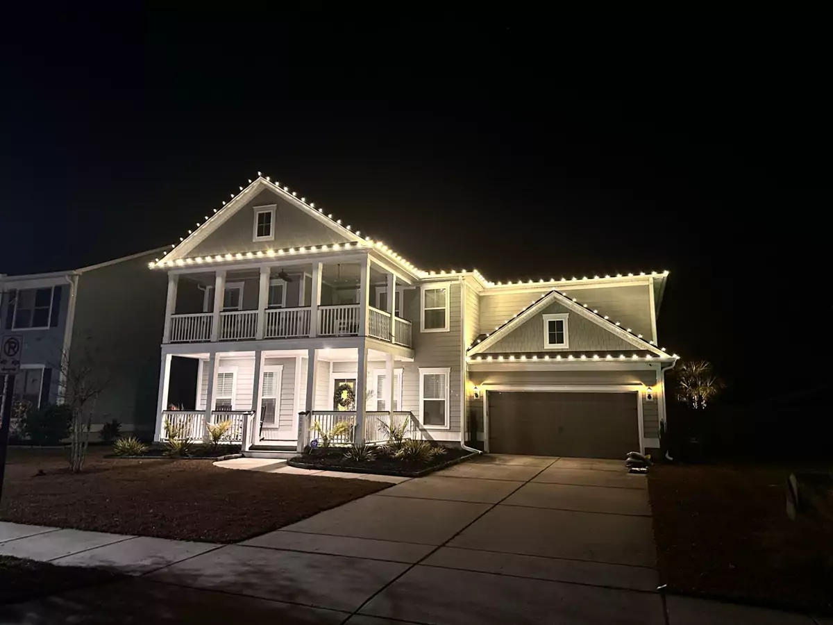 Home with double porches and lit rooflines